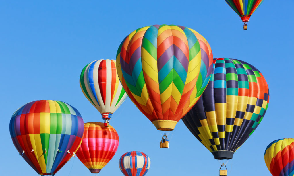 Hot air balloons rising in the sky